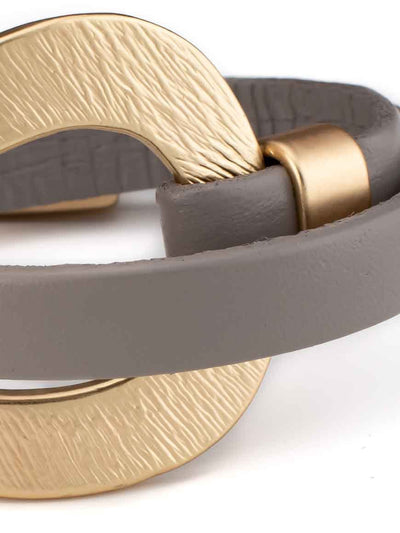 Elegant gold plated leather bracelet .