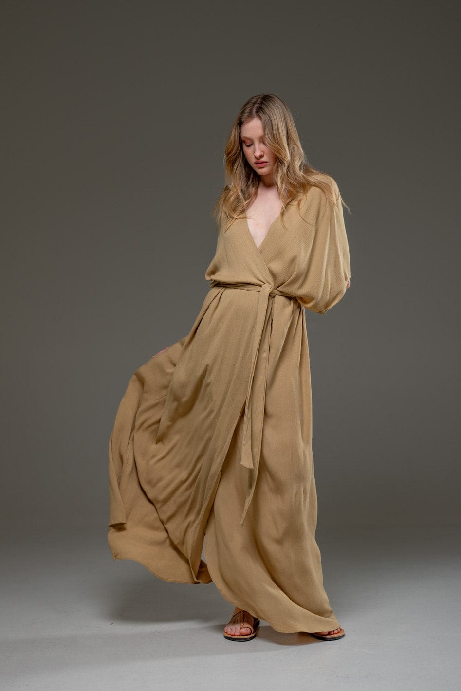 Elegant beige maxi dress with waist tie