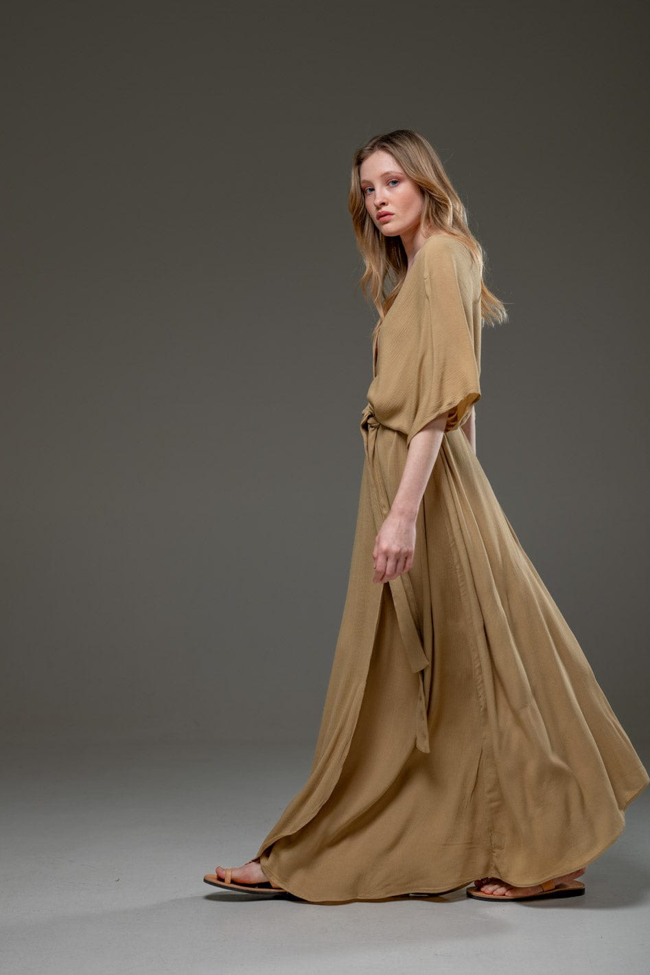 Elegant beige maxi dress with waist tie