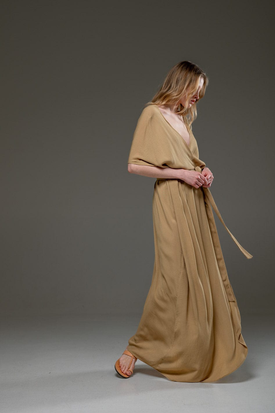 Elegant beige maxi dress with waist tie
