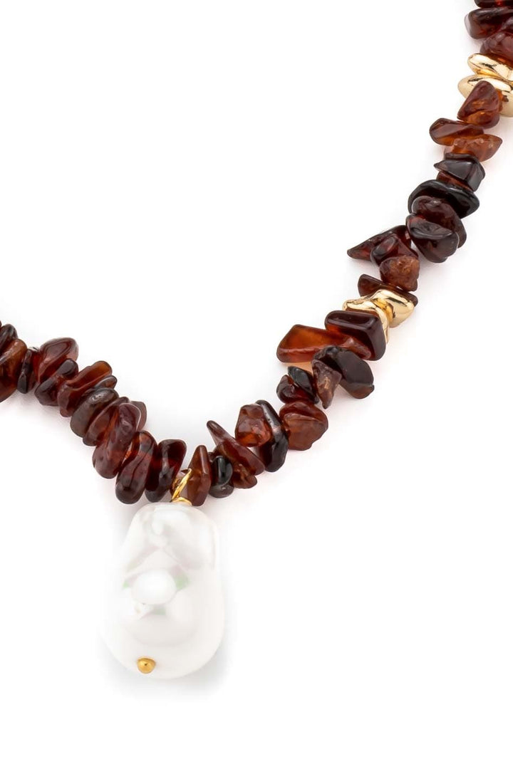 Boho necklace with brown natural stones and white pearl pendant