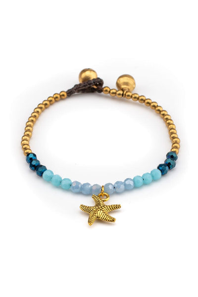 Bohemian chic handmade wax thread bracelet decorated with brass beads, blue stones and a small starfish pendant pendant