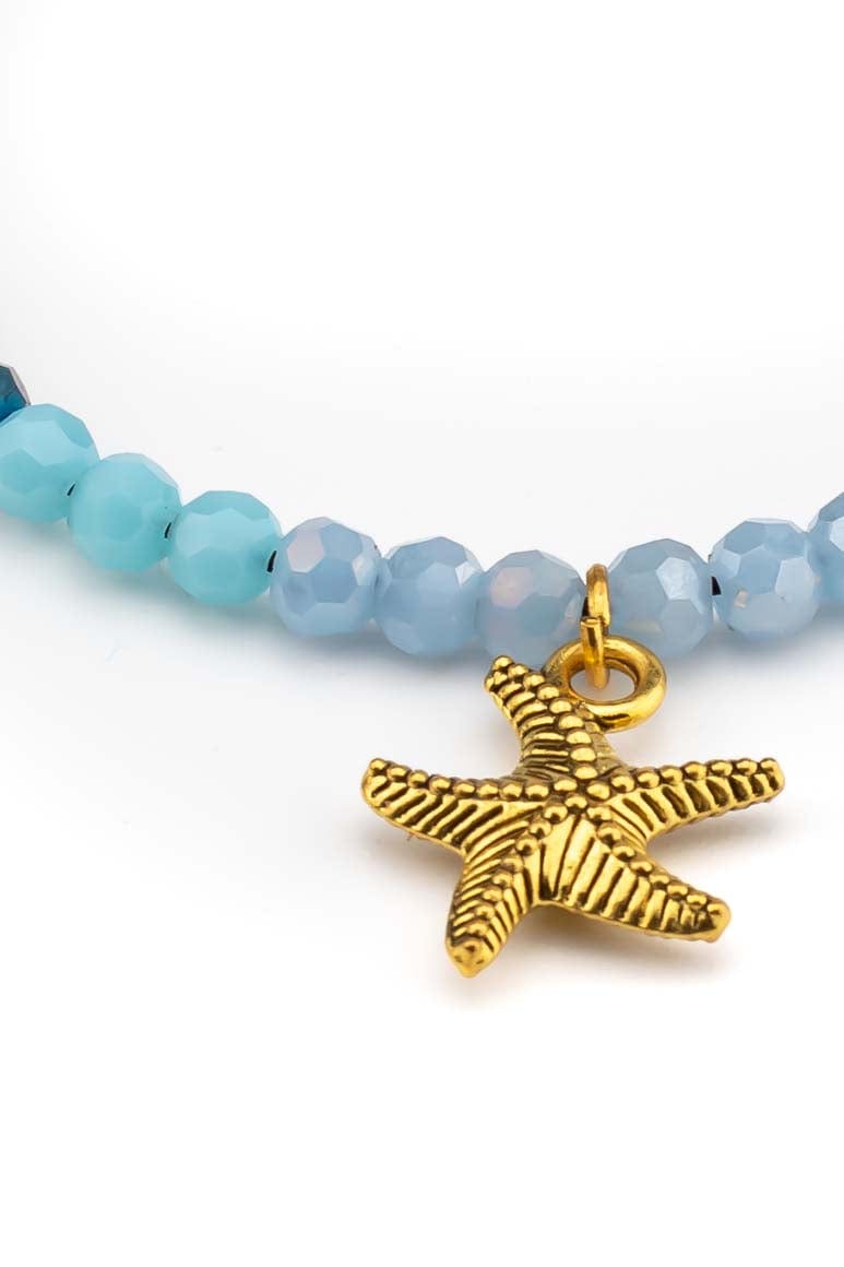 Bohemian chic handmade wax thread bracelet decorated with brass beads, blue stones and a small starfish pendant pendant